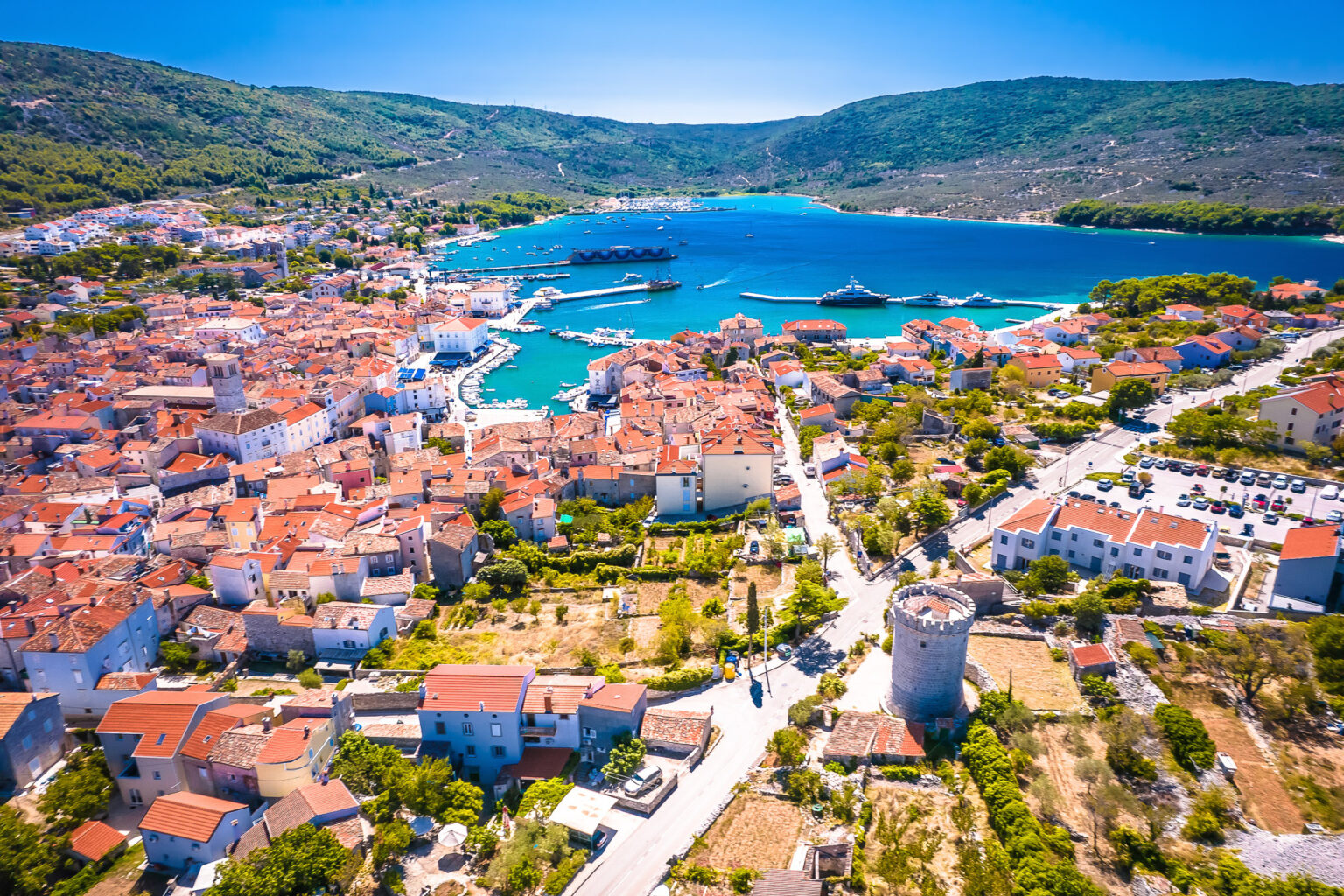 Aerial view of Cres town, its bell tower and harbour, island of Cres, Croatia
