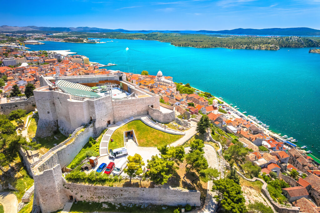 Aerial view of St Michael's Fortress above Šibenik's terracotta rooftops and blue harbour