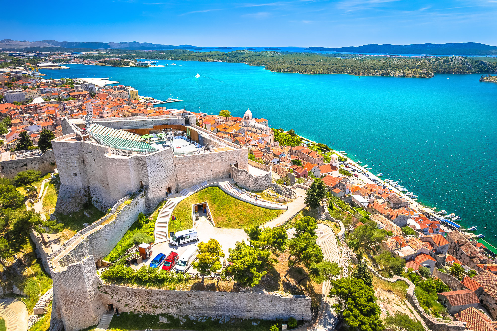 Aerial view of St Michael's Fortress above Šibenik's terracotta rooftops and blue harbour