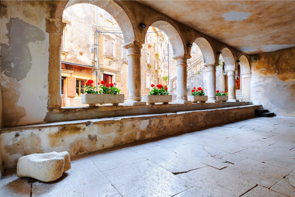 Stone arcades and medieval buildings in Grožnjan old town, Istria, Croatia