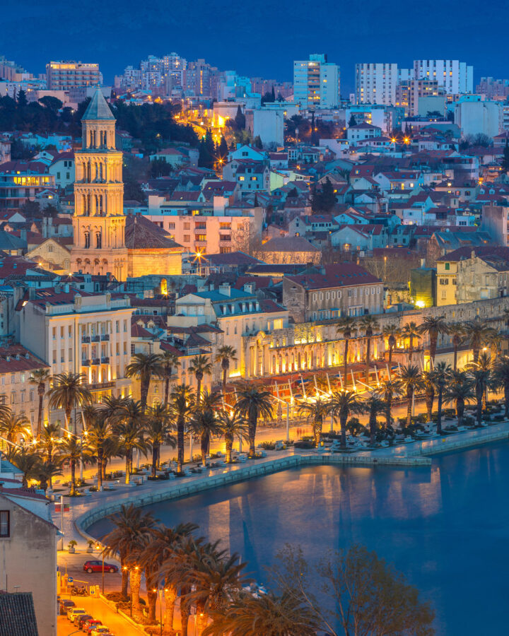 Split Riva waterfront and the cathedral bell tower in Diocletian’s Palace at dusk, Dalmatia, Croatia