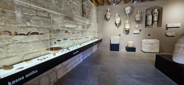 Ancient pottery, stone carvings and other archaeological finds displayed in a museum gallery