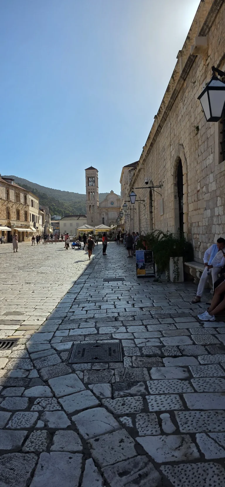 Stone-paved St Stephen’s Square in Hvar Town, with the cathedral and bell tower at the far end.